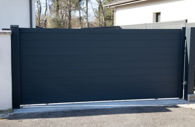 Custom automatic sliding gate with modern panel design installed by Auto Gate Guys Brisbane.